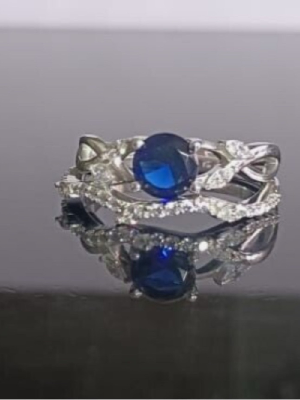 Sterling Sapphire-Style Twisted Halo Ring in Deep Blue